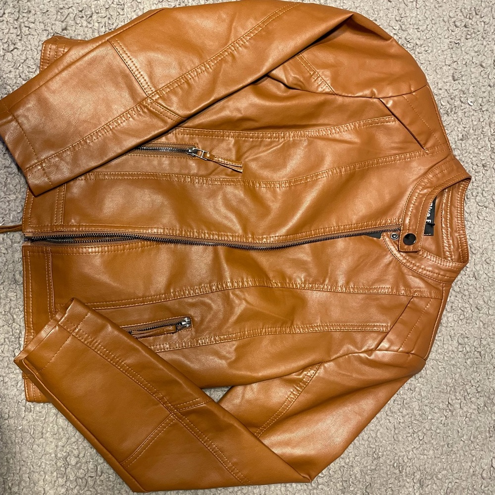 Brown pleather jacket . Size medium. Brand new no tags. Never worn .